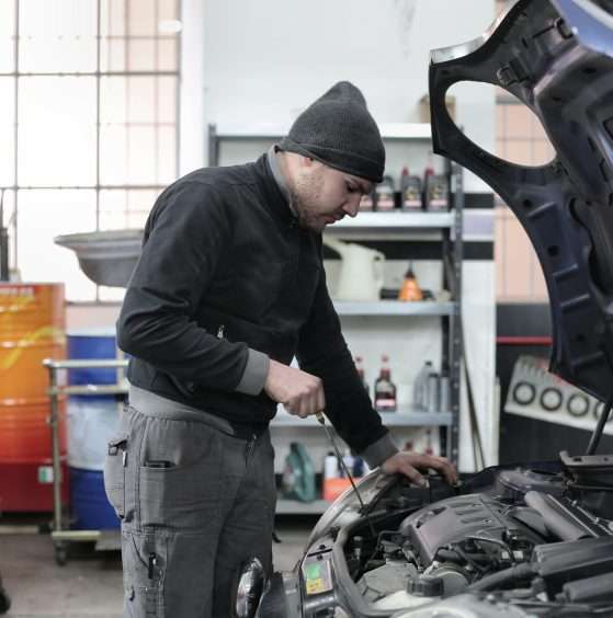 A man repairing auto